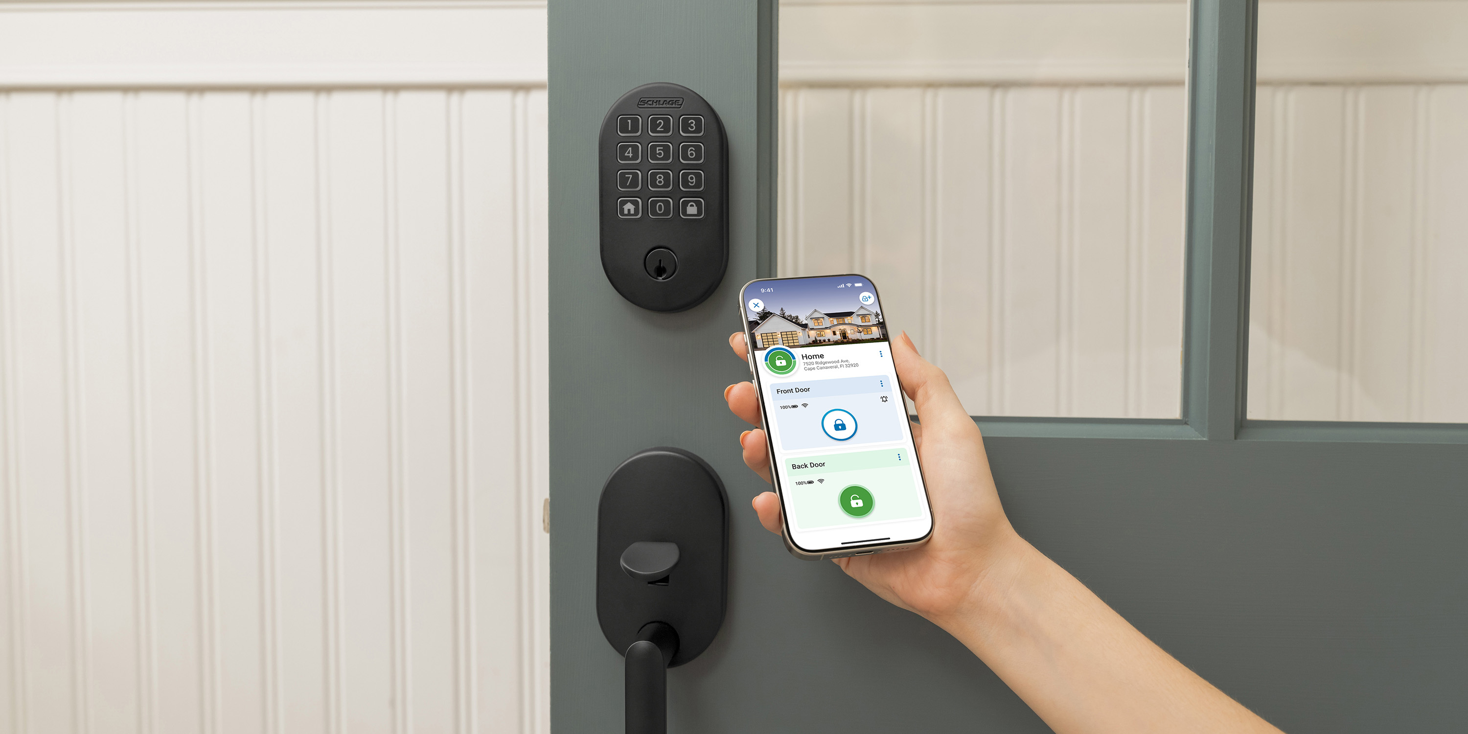 Person using the Schlage Home App on their iPhone to unlock their front door remotely.
