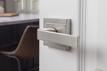 Contemporary home office with stylish door lever. 